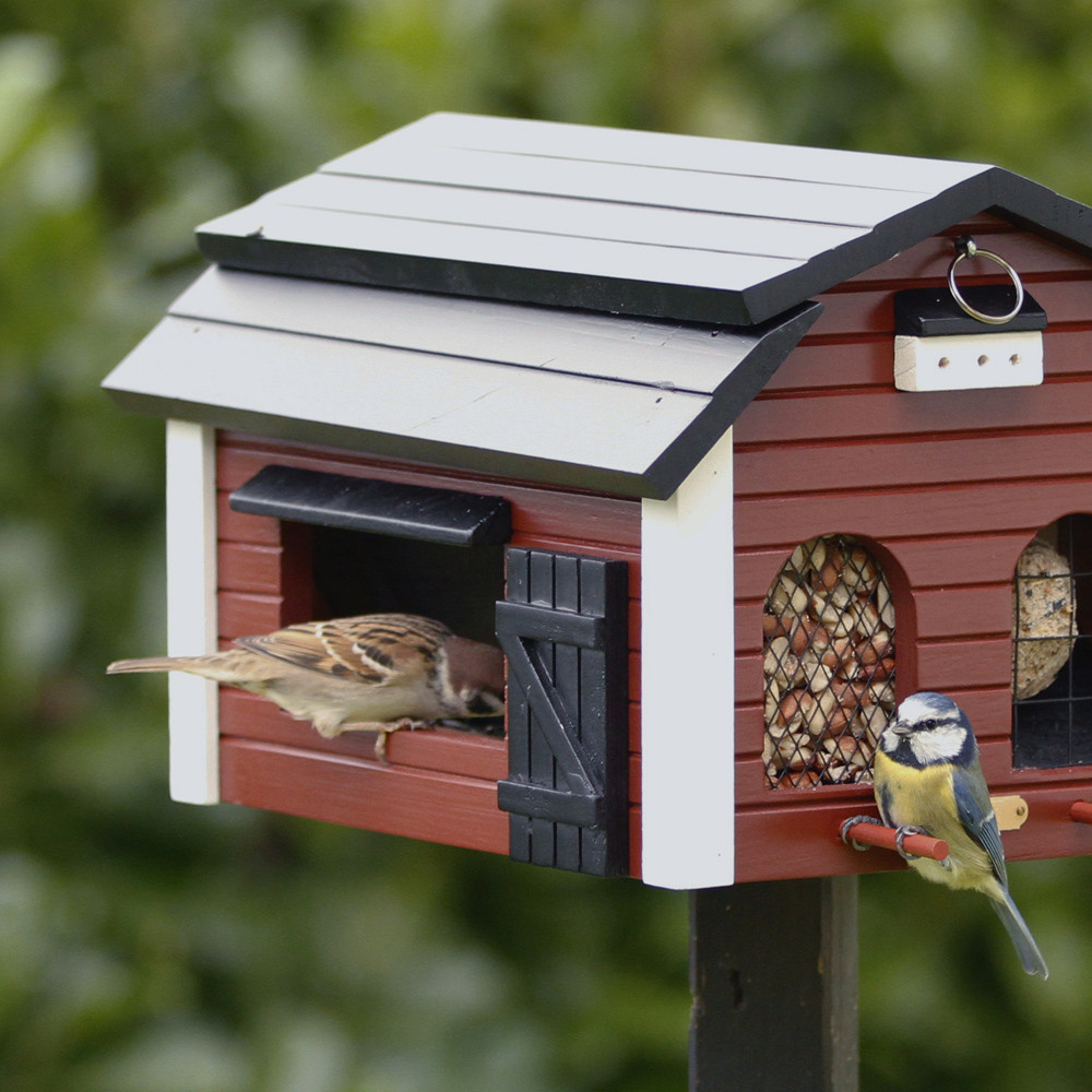 Mangeoire à oiseaux en bois sur pied et toit en zinc